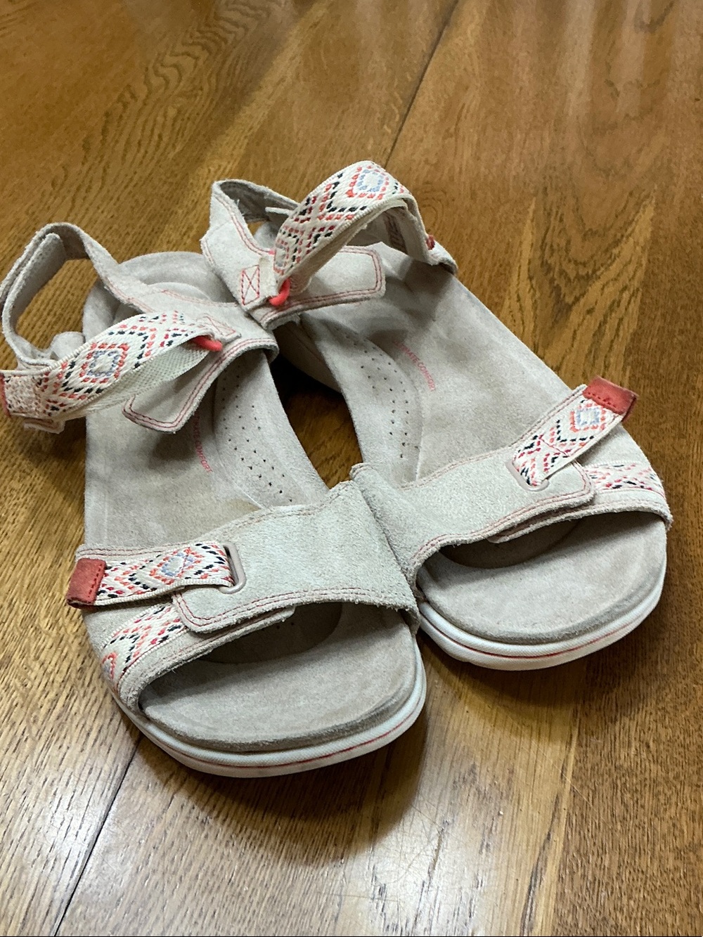 Woman’s Clarks cream suede sandals. Size 10. Hook +Loop closure on all straps.